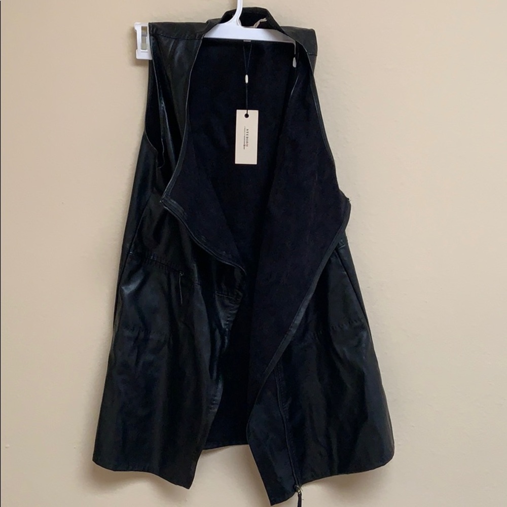 Faux leather black vest.